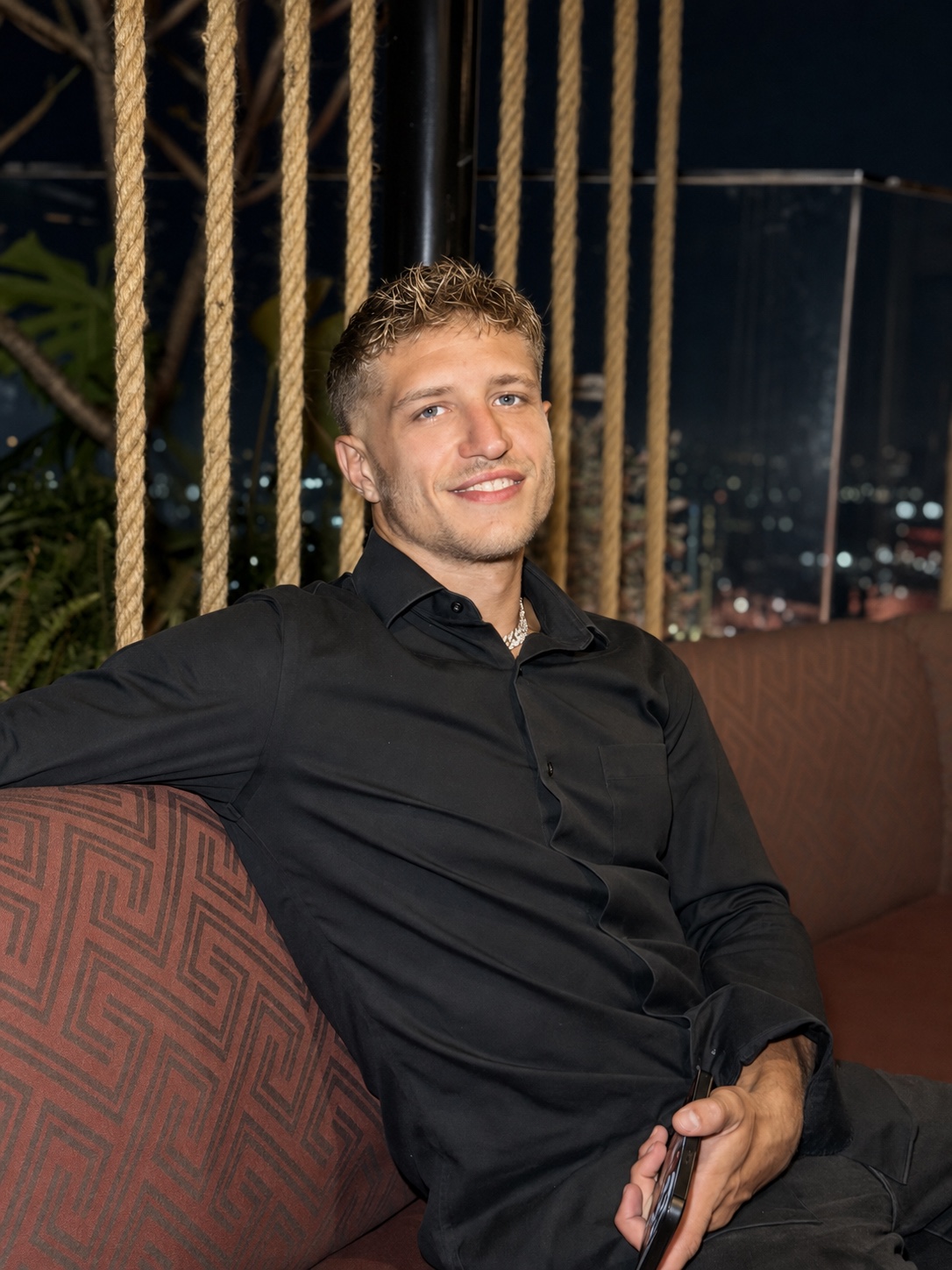 Minya, the founder of CELLIVITY, smiling in a black shirt